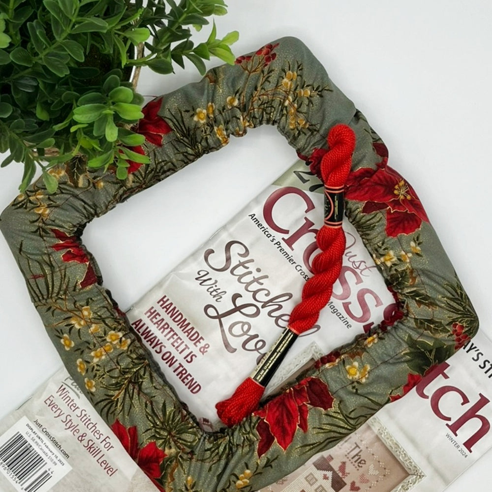 Christmas theme qsnap grime guard with poinsettias on green background.