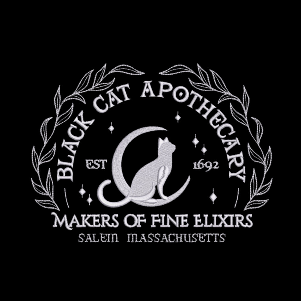 Black Cat Apothecary decorative throw pillow with a cat and moon design on a black background