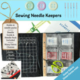 Sewing needle keeper with needle packs, guide, and scissors on a blue background