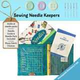 Sewing needle keeper with buttons and sewing needles on a blue background