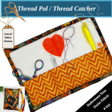 Thread catcher with fabric choices and sewing tools on a white background