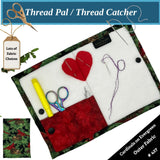 Thread Pal with fabric, scissors, and thread on a white background