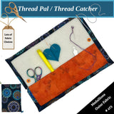 Thread catcher with sewing tools on a white background