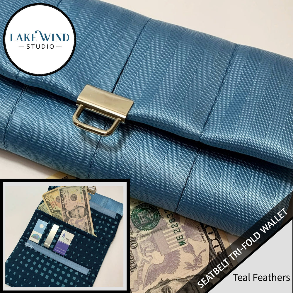 Blue seatbelt tri-fold wallet with gold buckle, Lake Wind Studio branding, and close-up of wallet on money.