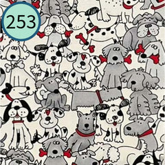 Dog party fabric. 100% cotton. Dogs with bones. White, black and red accents. 