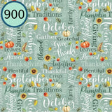 Textured fabric with autumnal words and pumpkins on a teal background