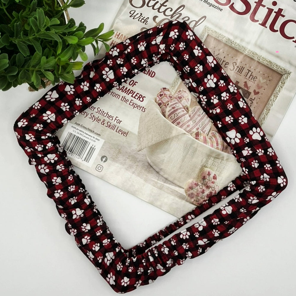 Red and black checkered grime guard qsnap frame paw print pattern on a magazine