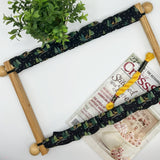 Scroll frame with winter theme grime guard with trees and deer. 